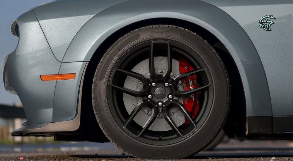 A close up shows the black rim on a grey 2023 Dodge Charger SRT Hellcat.