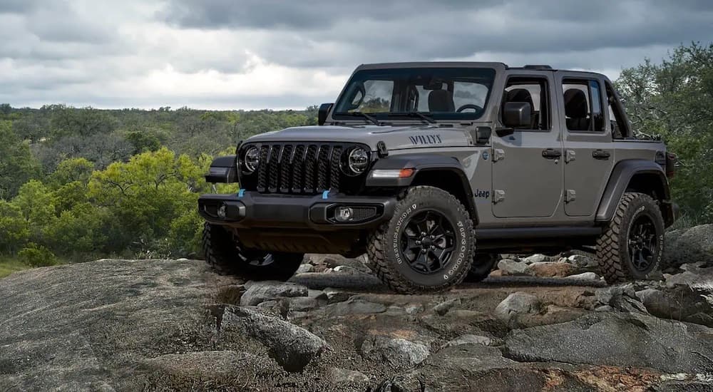 A grey 2023 Jeep Wrangler Willys is shown front he front at an angle.