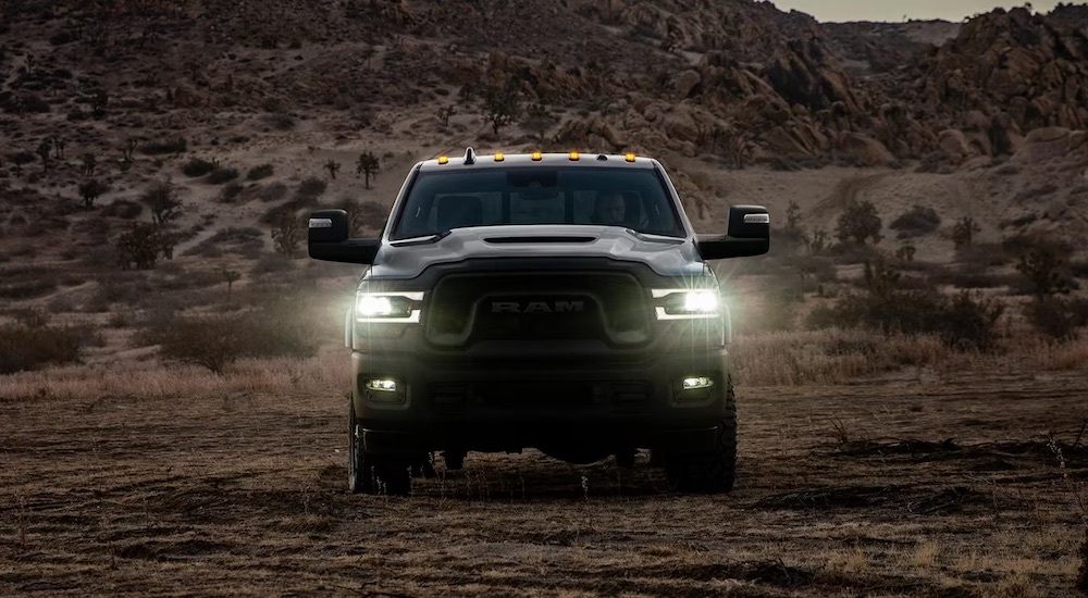 A black 2024 Ram 2500 is shown from the front after leaving a Ram dealer.