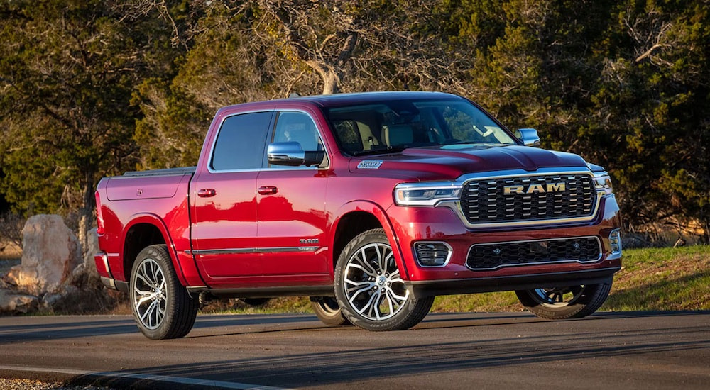 A red 2025 Ram 1500 Tungsten is shown from the front at an angle.