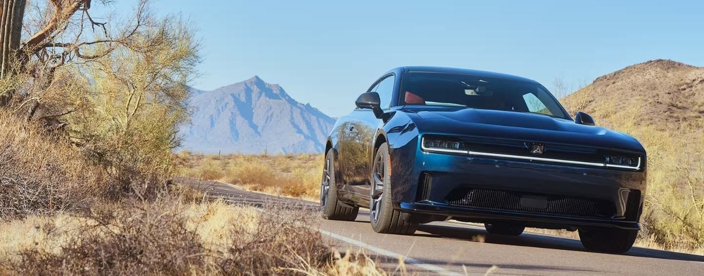 A blue 2025 Dodge Charger Daytona from the front.