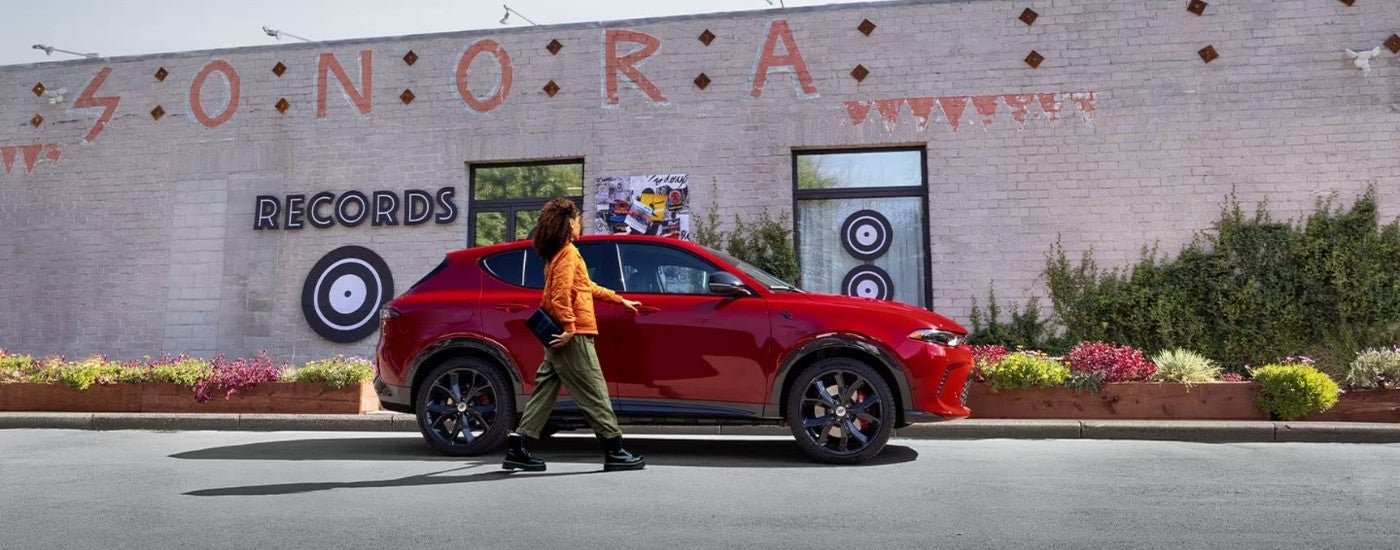 A red 2025 Dodge Hornet from the side.