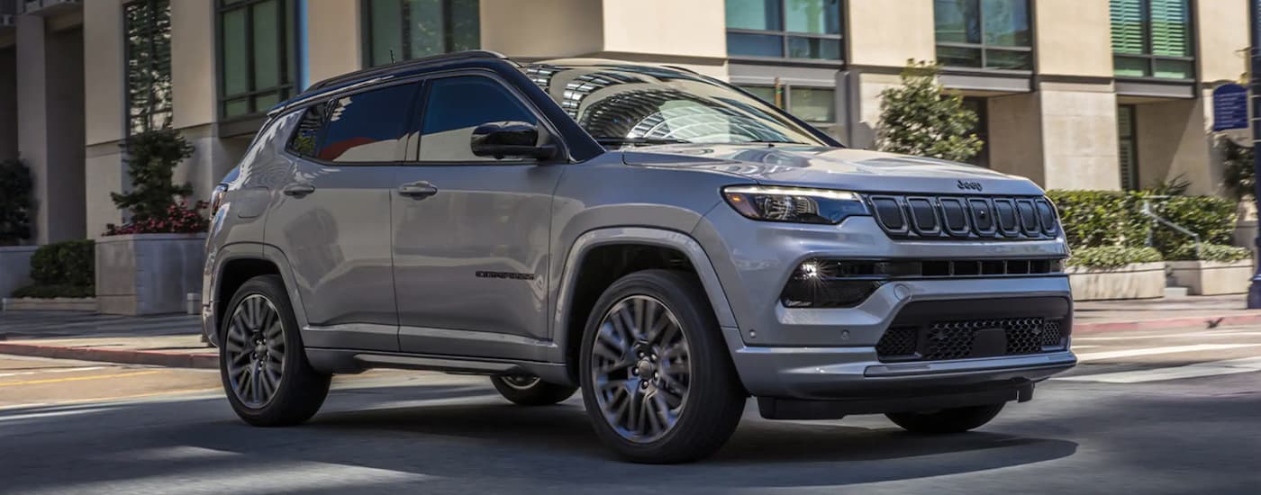 A grey 2022 Jeep Compass driving to a Jeep dealer near Eureka.
